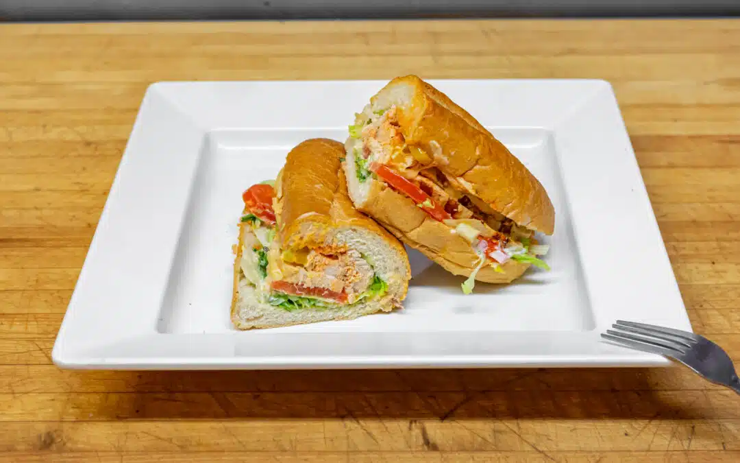 Delicious grilled chicken sandwich with banana peppers, hot sauce, ranch dressing