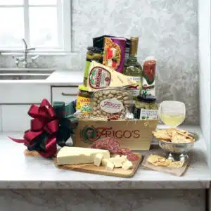 Appetizer Gift Basket with Italian cheese, artisan crackers, olives and savory snacks arranged in a rustic gift basket