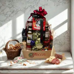 Frigo Feast Gift Basket overflowing with premium Italian pasta, imported sauce, olive oil and biscotti in a woven basket