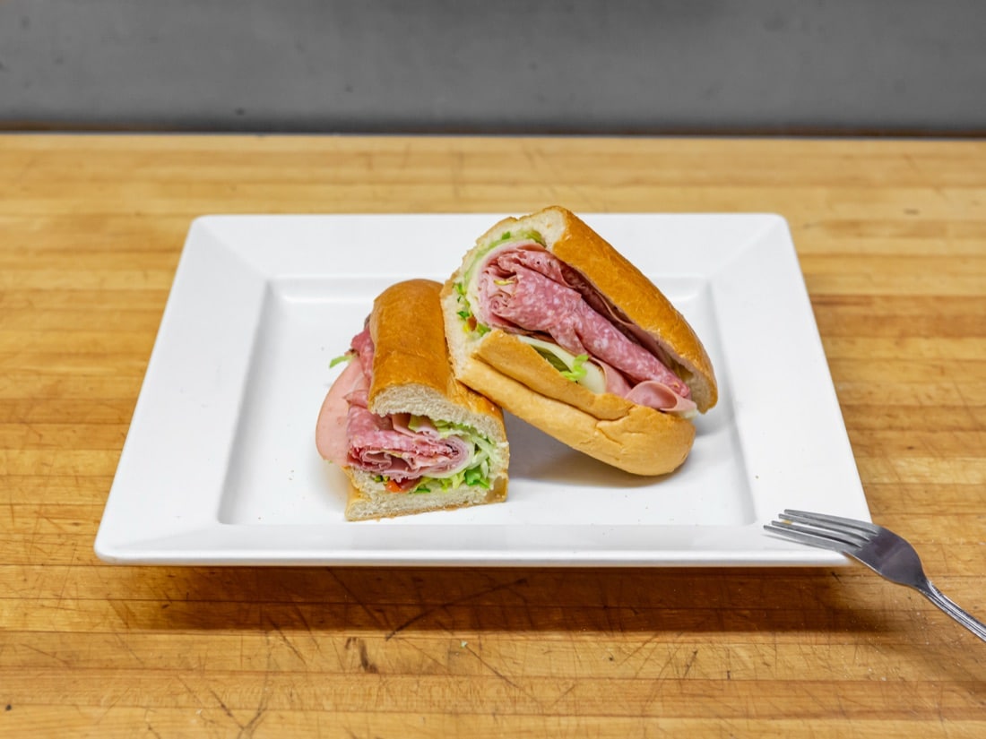 Takeout Menu Frigo's Classic Italian sub cut in half