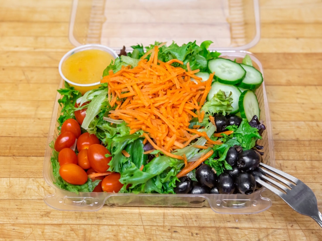 Takeout Menu Fresh garden salad with tomatoes, carrots, cucumbers and olives